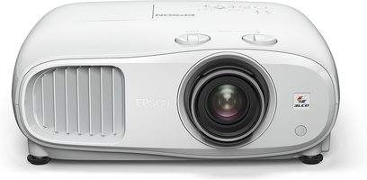 Epson EH-TW7000 white video projector, front view, centered lens, side ventilation grilles, "3LCD" logo in bottom right corner