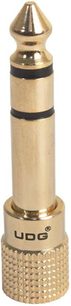 Adaptador jack banhado a ouro UDG U 94002, cilindro metálico dourado, faixas pretas, logotipo gravado, close-up