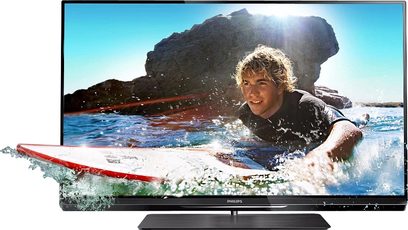 Philips 47PFL6007H-fladskærm viser en dreng, der surfer på en bølge, med synlige vandsprøjt på skærmen
