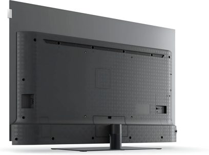 Televizor Loewe We. SEE 55 OLED dc negru văzut din spate cu picior central plat și conectică laterală
