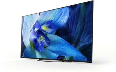 Sony KD-55AG8 tv set forfra, OLED-skærm der viser et nærbillede af en blå irisblomst på en mørkeblå baggrund