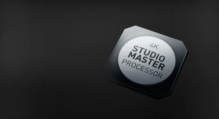 4K Studio Master processor etched onto a hexagonal metal chip, shown in perspective view on a black background