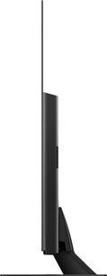 Panasonic TX-65FZ800E-fladskærms-tv, set fra siden, flad skærm, smal sort ramme, centreret rektangulært sort fod