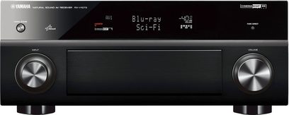Front panel of a Yamaha RX-V1073 black home theater receiver, display screen, numerous control buttons and knobs