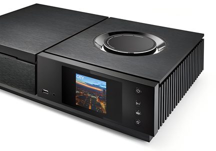 black brushed metal audio device, 3/4 front view, top knob, color display, USB and jack ports, side fins