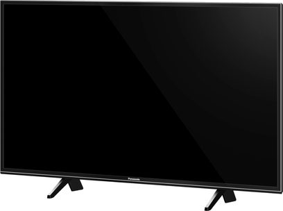 Fladskærms-TV Panasonic TX-43FX600 med rektangulært sort panel på sorte fødder, set forfra