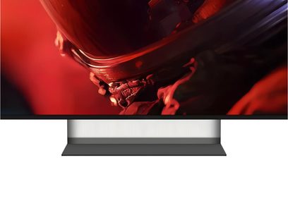 Televisor Sony BRAVIA 9 II K65XR9 de frente, pantalla fina con borde negro, amplio pie central gris e imagen rojo oscuro