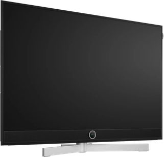 Téléviseur Loewe Stellar 48 DR+ noir vue de face légèrement en angle avec barre de son intégrée et pied argenté