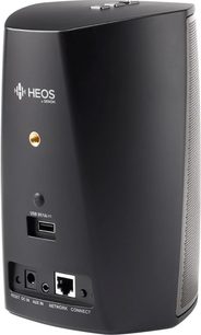 Trådløs, tilsluttet Denon HEOS 1 HS2 højttaler i sort, set forfra, cylindrisk form, mat sort finish, knapper og porte på siden