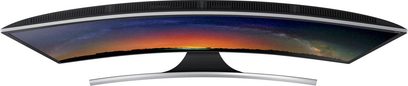 Samsung UE48JS8500 buet TV set forfra, slukket skærm der reflekterer en farverig solnedgang