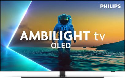 Widok z przodu telewizora Philips 65OLED850 w czarnym kolorze z cienką metalową ramką i płaskim ekranem OLED zajmującym niemal całą powierzchnię, ustawionego na centralnej metalowej podstawie