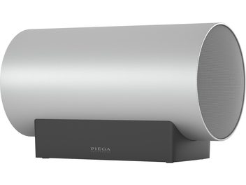 Sub Medium Wireless subwoofer sølv, set fra siden, cylindrisk form, cirkulært gitter, sort rektangulær stander
