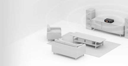 Perspective view of a living room with a sofa, armchair, coffee table, TV stand, black amplifier, 2 speakers, rectangular rug