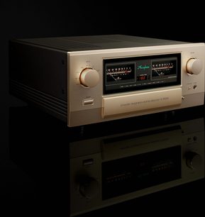Integreret stereo hi-fi forstærker E-5000, trekvart visning, gylden front, to store cirkulære knapper, to centrale vu-metre