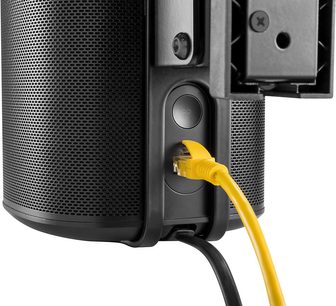 Czarna ścienna podstawka do głośnika bezprzewodowego, z żółtym przegubowym ramieniem i złączem Ethernet. Zbliżenie z boku