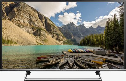 Panasonic TX-40DS500E-fladskærms-tv, der viser et bjerglandskab med en turkisblå sø og trækajakker i forgrunden