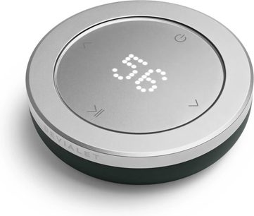 Dálkový ovladač hifi DEVIALET Remote Deep Forest kulatý stříbrný s tmavě zelenou základnou a centrálním světelným displejem