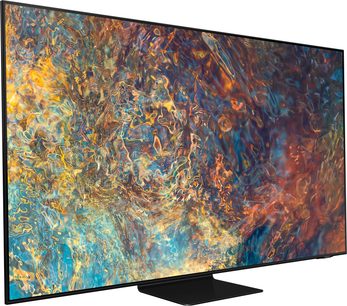 Samsung QE50QN90A-fladskærm, der viser et abstrakt, farverigt billede i varme toner af gult, orange og blåt