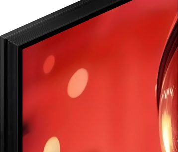Televisor Sony BRAVIA 9 II K65XR9 negro en vista de cerca, borde fino y pantalla roja luminosa