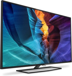 Philips 40PUH6400 fladskærms-tv, der viser et abstrakt billede af farvede klipper i blå, orange og violet