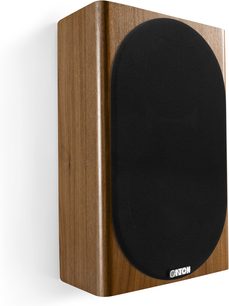 Canton Townus 10 wandluidspreker in notenhout, zijaanzicht, houten behuizing en grote afgeronde zwarte frontgrille