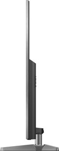 Panasonic TX-75FX780 fladskærms-TV set fra siden, flad skærm, mørk grå metalramme og -fod, rektangulær base