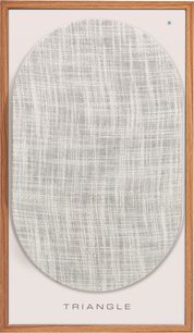 Oval light gray mottled fabric speaker in a light wood frame, front view
