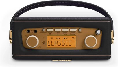 Roberts Revival Uno BT bordradio i sort kunstlæder, gylden metalfront med ravfarvet LCD-skærm, to sidevendrede knapper, række af rektangulære knapper og buet øvre håndtag, set forfra