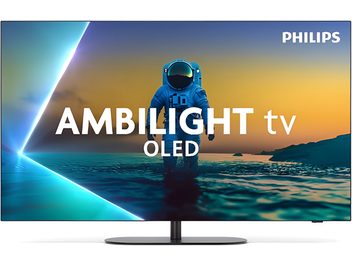 Телевізор високої чіткості Philips 42OLED810 чорного кольору з тонкою металевою рамкою та OLED-скляною панеллю, встановлений на центральній циліндричній металевій підставці з овальною основою, вид спереду