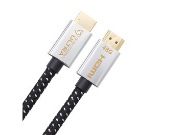 Tributaries UHDU Ultra HDMI-kaapeli 1m kultapinnoitetuilla liittimillä, hopeisilla koteloilla, kultaisella tekstillä ja mustavalkoisella punotulla suojauksella