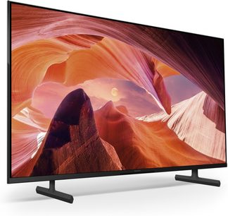 Sony 55X80L-fladskærm, der viser et billede af en orange og rosa klippecanyon med former, der er formet af erosion