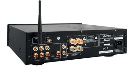 Taga Harmony HTA-1000B sort hi-fi stereforstærker, set forfra, med stik og knapper på forsiden, Wi-Fi-antenne på toppen