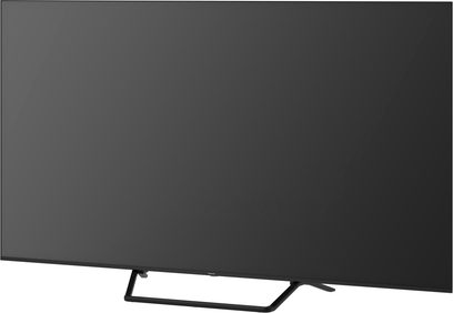 Panasonic TV-75W95BEG sort fladskærms-tv i høj opløsning, med glasplade og smal plastikramme monteret på et rørformet metalstativ, set fra trekvart forfra