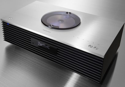 Trådløs forbundet Technics SC-C70MK2EGS-højttaler, set ovenfra, sort front med CD-skive, sølvfarvede kontrolknapper