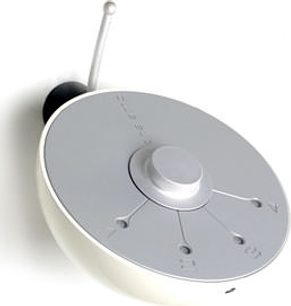 Scandyna The Amp stereo hi-fi forstærker, set ovenfra, lys grå cirkulær overdel, sort centralt drejeknap