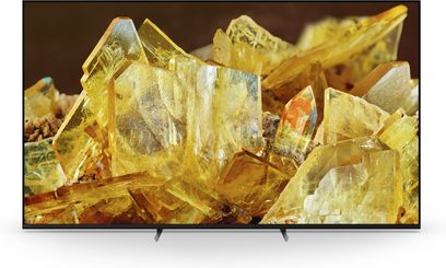 Sony XR85X90L fjernsyn, fladskærm, set forfra, gennemsigtige gule krystaller, sort ramme, dobbeltstativ