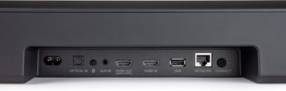 Front view of the black Denon Home 550 soundbar showing the optical, auxiliary, HDMI, USB, network, and Connect ports
