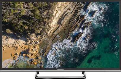 Panasonic TX-32ES500E-fladskærm, der viser en klippestrand, træer og bølger, der bryder mod klipperne