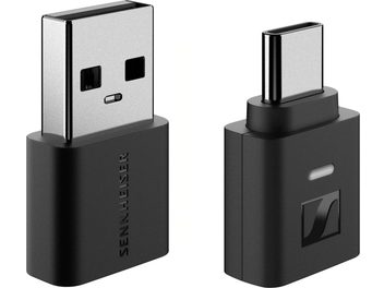 Sennheiser BTD 700 wireless transmitter in matte black plastic, two compact dongles shown in isometric view: one with a silver USB-A connector and Sennheiser side marking, the other with a silver USB-C connector, Sennheiser logo, and oval indicator light on the front