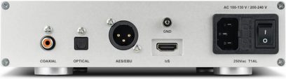 Bagside af en sort Nuprime CDT-10 CD-afspiller med coaxial-, optisk-, AES/EBU-, I2S-stik, strømforsyning og kontakt