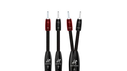 Set of speaker cables with black braided sleeve, metal banana plugs, red and black sleeves labeled AMP/SPEAKER