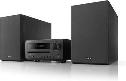Mini-anlæg Hi-Fi Denon D-T1 sort bestående af en forstærker med skærm, knapper og drejeknap, og to rektangulære højttalere, set forfra