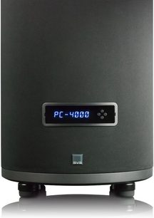 Sort lakeret cylindrisk subwoofer SVS PC-4000 set forfra, blåt LED-display, koniske fødder