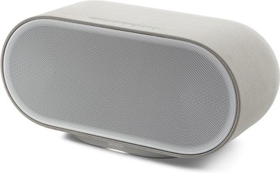 Grå Denon Home 600 connected højttaler, oval form, perforeret metalfront, stofbetræk set i trekvart profil