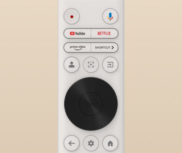 Telecomando bianco con pulsanti circolari e rettangolari, loghi YouTube, Netflix, Prime Video, microfono, cerchio nero centrale