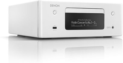 Kompakt Denon RCD-N10 højkvalitets hi-fi-system i hvid med LCD-skærm, der viser "Violin Concerto No.1-D...", set forfra