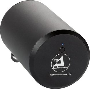 Černý válcový externí napájecí zdroj, pohled v perspektivě, logo a text "Professional Power 12V" na přední straně, modrá kontrolka