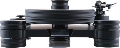 Transrotor Dark Star TRA Studio hi-fi pladespiller i mat sort massiv polymer med tyk cirkulær pladetallerken, cylindriske dæmpende fødder og tonearm til højre, set forfra