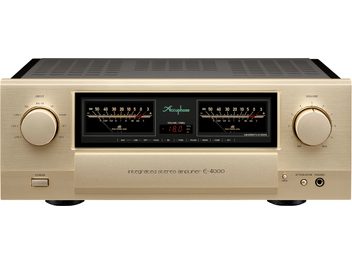 Integroitu stereo hi-fi -vahvistin E-4000, etunäkymä, kultainen viimeistely, 2 suurta pyöreää nuppia, 2 VU-mittaria, keskellä näyttö