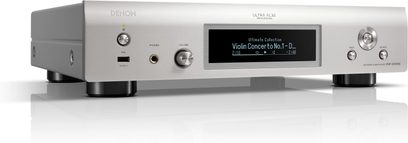 Leitor de áudio em rede Denon DNP-2000NE prata, vista frontal, display LCD, botões e controles giratórios, portas USB e de rede